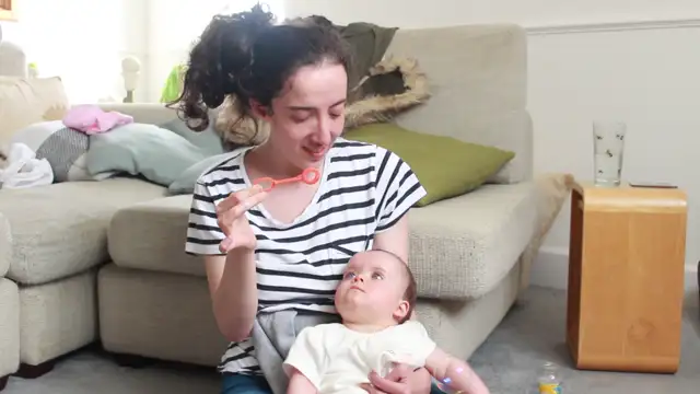 Aria Playing with Bubbles