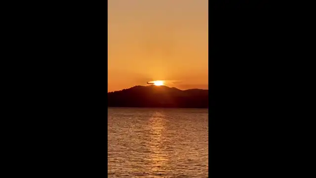 Plane going through sunset for website