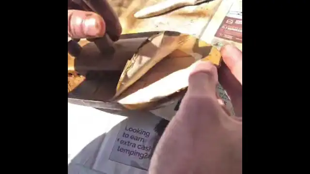 Peeling masking tape from boat model